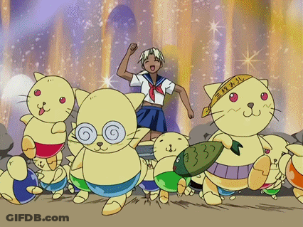 A Girl In A Sailor Uniform Is Surrounded By Cats With One Wearing A Bandana With The Number 33 On It GIF