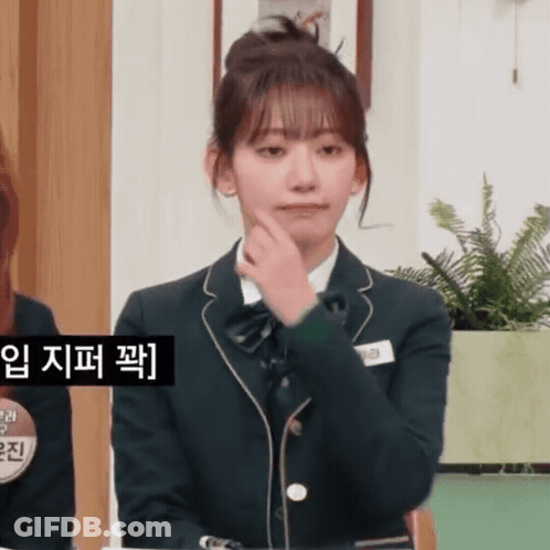 A Girl In A School Uniform Has A Name Tag That Says ' Eun ' On It GIF