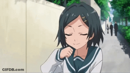 A Girl In A School Uniform Has Her Eyes Closed And Is Smiling GIF