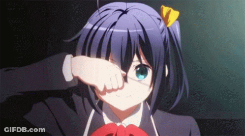 A Girl In A School Uniform Is Covering Her Eyes With Her Hand . GIF