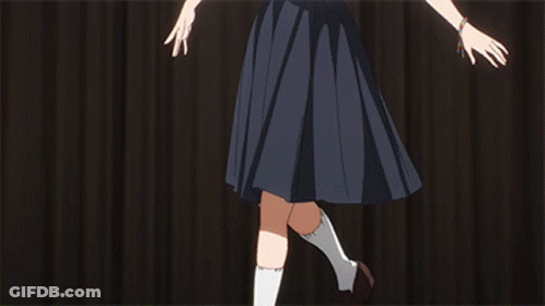 A Girl In A School Uniform Is Doing A Split With Her Legs In The Air GIF