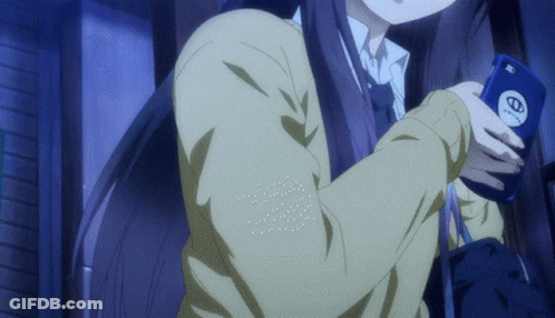 A Girl In A School Uniform Is Holding A Cell Phone With The Letter O On It GIF