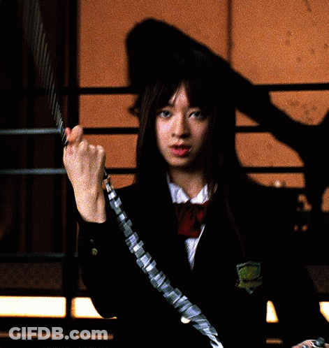 A Girl In A School Uniform Is Holding A Chain Around Her Wrist GIF