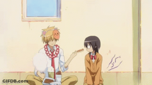 A Girl In A School Uniform Is Holding A Piece Of Food GIF