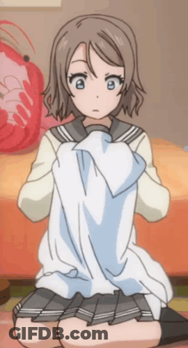 A Girl In A School Uniform Is Kneeling On The Floor GIF