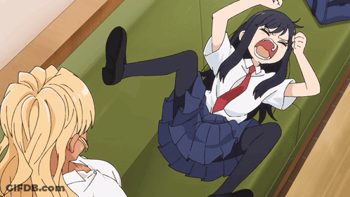 A Girl In A School Uniform Is Laying On Her Stomach With Her Mouth Open GIF