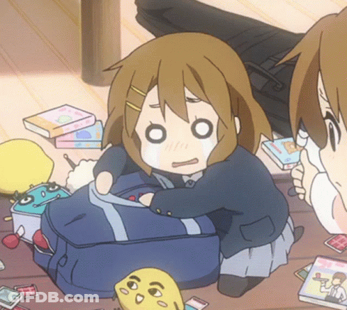 A Girl In A School Uniform Is Sitting On The Floor With A Backpack GIF