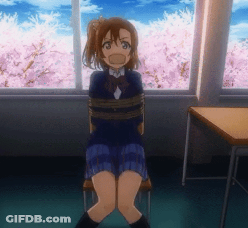 A Girl In A School Uniform Is Tied Up In A Room With Cherry Blossoms In The Background GIF