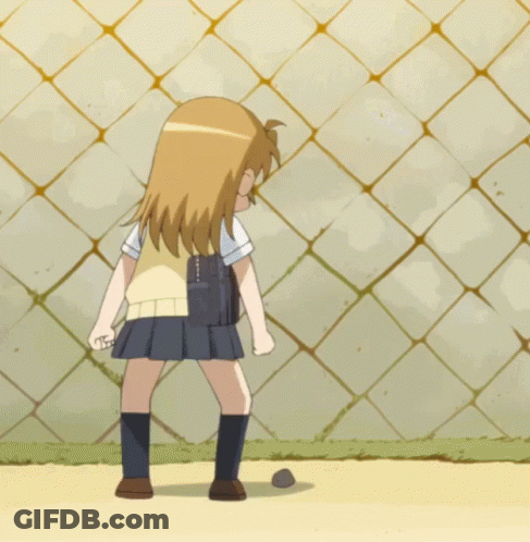 A Girl In A School Uniform Kicking A Ball GIF