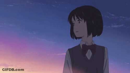 A Girl In A School Uniform With A Bow Tie Looks At The Sky GIF