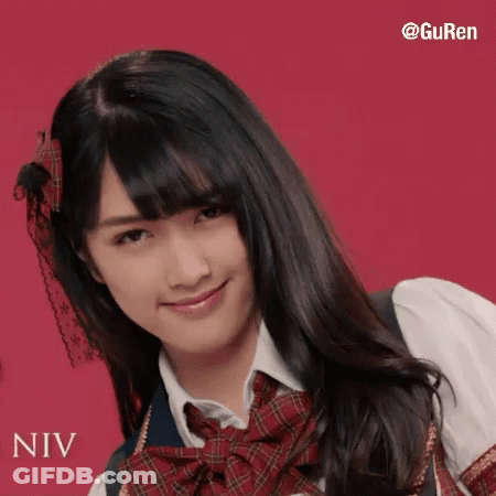 A Girl In A School Uniform With The Name Niv Written On The Bottom GIF