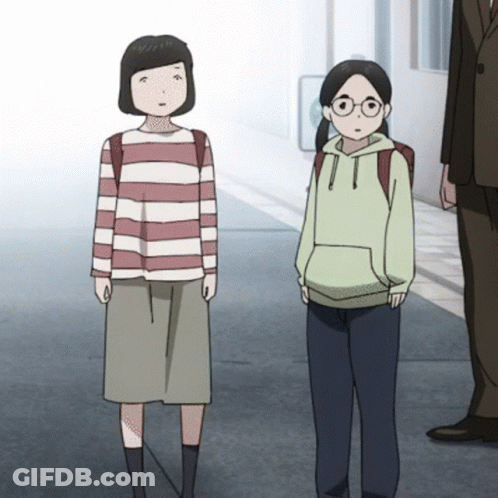 A Girl In A Striped Shirt And A Girl In A Green Hoodie Are Standing Next To Each Other On A Sidewalk GIF