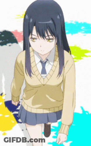 A Girl In A Sweater And Tie Is Walking Down A Street GIF