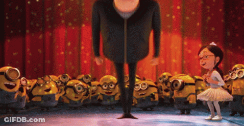 A Girl In A Tutu Stands Next To A Man In A Black Jacket GIF