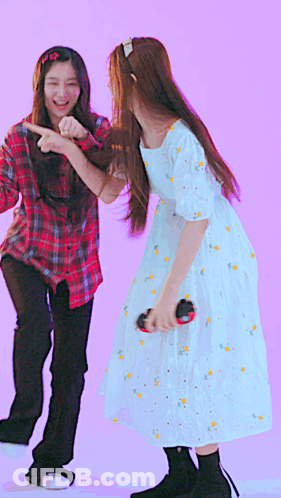 A Girl In A White Dress Is Dancing With Another Girl GIF