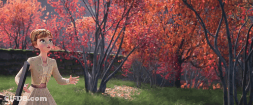 A Girl In A White Dress Is Standing In A Forest With Red Leaves GIF