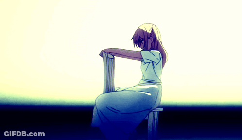 A Girl In A White Dress Sits On A Stool GIF