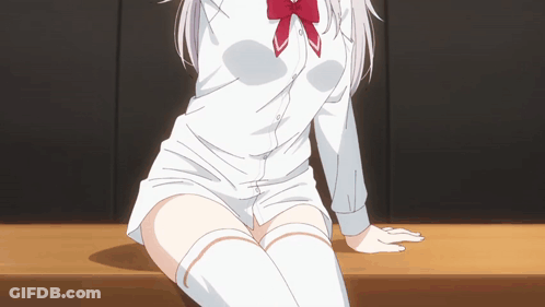 A Girl In A White Shirt And Knee High Socks Sits On A Table GIF