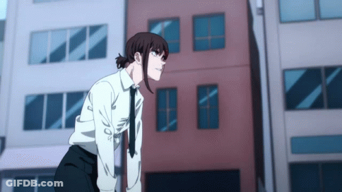 A Girl In A White Shirt And Tie Is Standing In Front Of A Building GIF