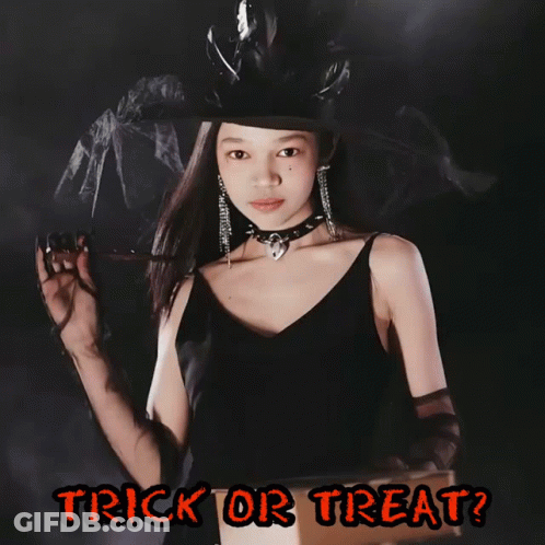 A Girl In A Witch Costume Is Holding A Flashlight And The Words Trick Or Treat Are Below Her GIF