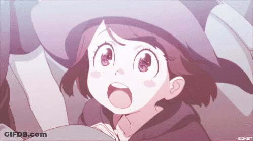 A Girl In A Witch Hat Is Looking Up With Her Mouth Wide Open GIF