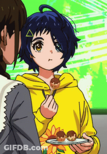 A Girl In A Yellow Hoodie Is Holding A Plate Of Food In Her Hand GIF