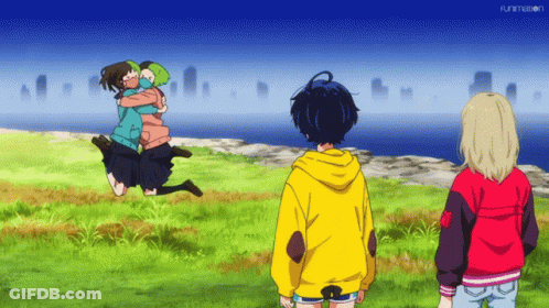 A Girl In A Yellow Hoodie Is Hugging Another Girl In A Green Jacket GIF