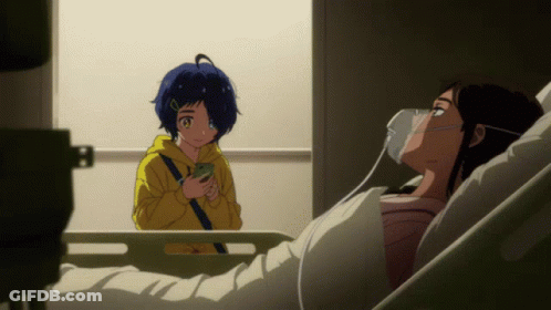 A Girl In A Yellow Hoodie Is Standing Next To A Woman In A Hospital Bed With An Oxygen Mask On Her Face GIF