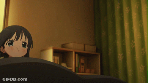 A Girl In A Yellow Shirt Is Standing In A Room GIF