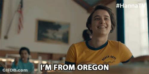 A Girl In A Yellow Shirt With The Words I 'M From Oregon GIF