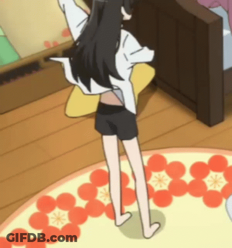 A Girl In Shorts And A White Shirt Is Standing On A Rug With Flowers On It GIF