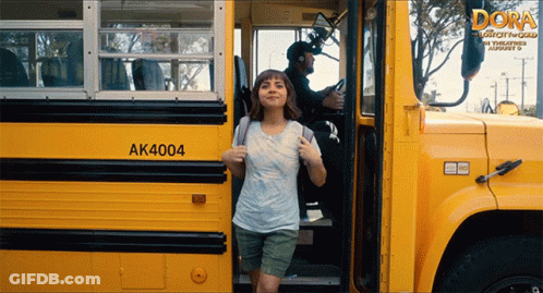A Girl Is Getting Off A Yellow School Bus With The Number Ak4004 On The Side GIF