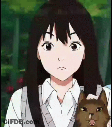 A Girl Is Holding A Cat In Her Arms And Making A Face . GIF