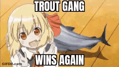 A Girl Is Holding A Fish On A Wooden Floor With A Meme That Says `` Trout Gang Wins Again '' . GIF