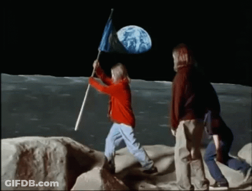 A Girl Is Holding A Flag On The Moon GIF