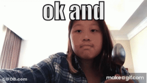 A Girl Is Holding A Spoon In Front Of A Screen That Says Ok And Make A Gif.com GIF