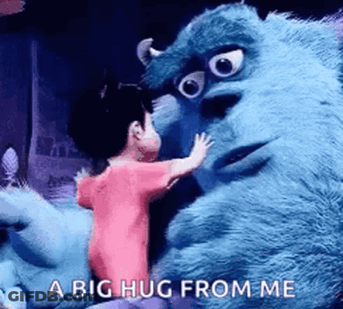 A Girl Is Hugging A Stuffed Animal From Monsters Inc . GIF