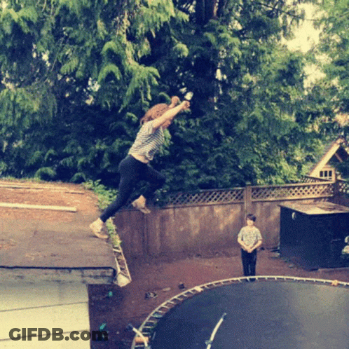 A Girl Is Jumping On A Trampoline While A Boy Looks On GIF