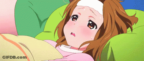 A Girl Is Laying In Bed With A Thermometer On Her Head GIF