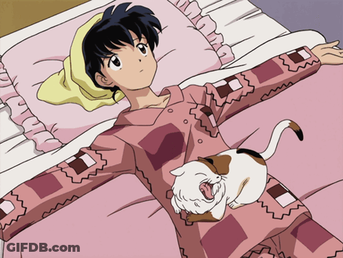 A Girl Is Laying On A Bed With A Cat On Her Shoulder GIF