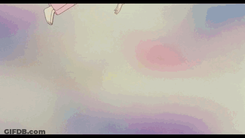 A Girl Is Laying On A Bed With A Red Blanket With Flowers On It GIF