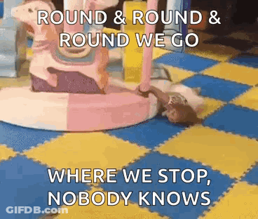 Girl Lying On Floor With Carousel And Quote GIF