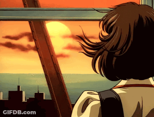 A Girl Is Looking Out A Window At The Sunset Over The Ocean GIF