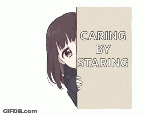 A Girl Is Peeking Over A Wall With A Sign That Says Caring By Staring . GIF