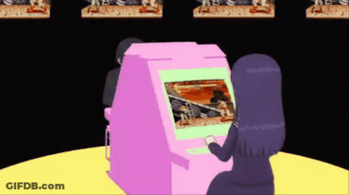 A Girl Is Playing A Video Game In A Pink Machine GIF