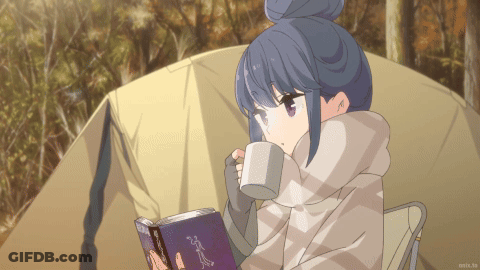A Girl Is Reading A Book And Drinking From A Mug In Front Of A Tent GIF