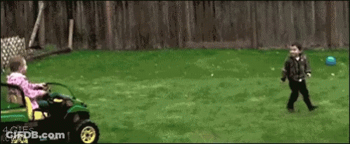 A Girl Is Riding A Lawn Mower Next To A Boy Playing With A Blue Ball GIF