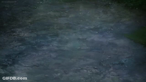 A Girl Is Running In Front Of A Tree With White Flowers GIF