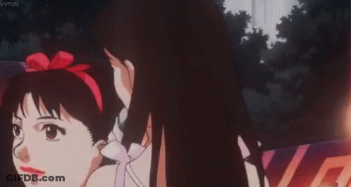 A Girl Is Singing Into A Microphone In A Car . GIF