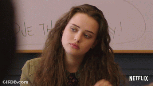 A Girl Is Sitting In Front Of A Whiteboard That Says Due This GIF